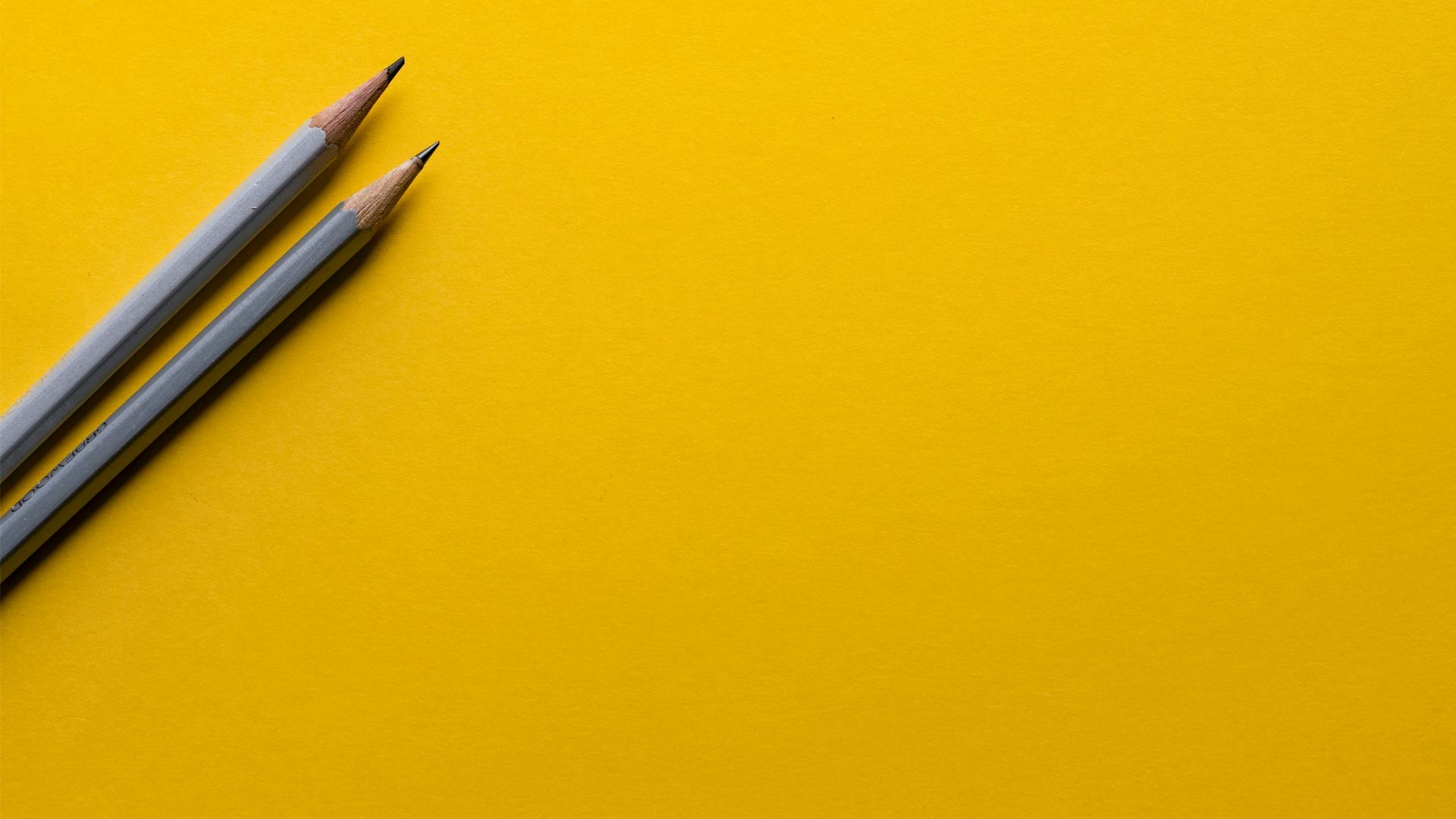 pencils on yellow background